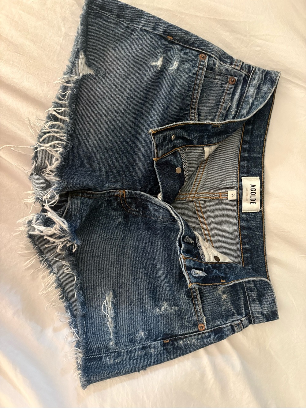 Agolde Frayed Hem Distressed Denim Shorts in Blue